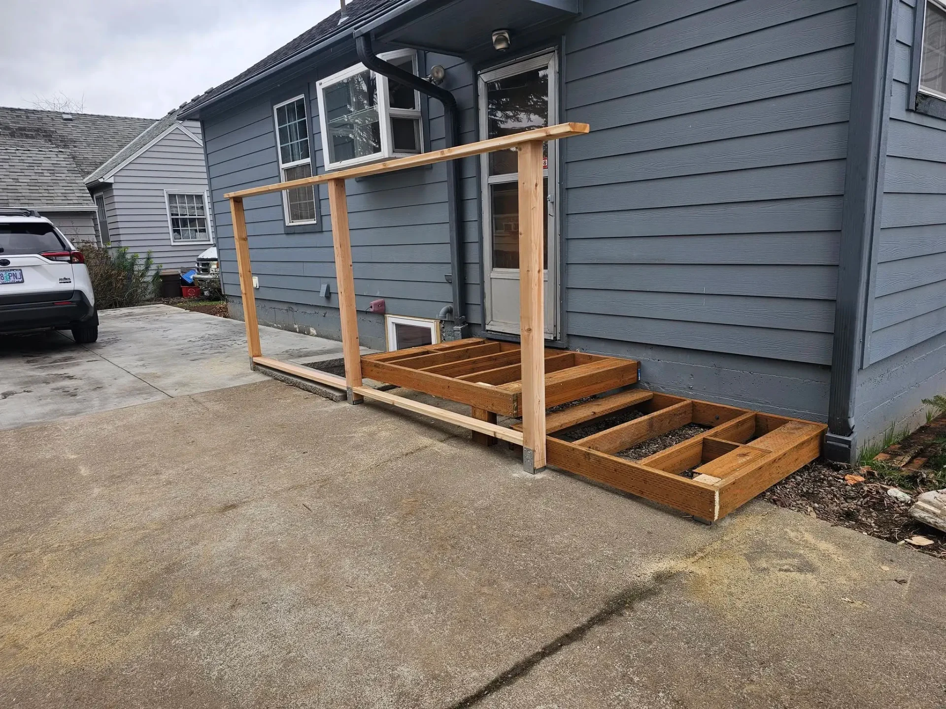 Entry deck frame with railing posts