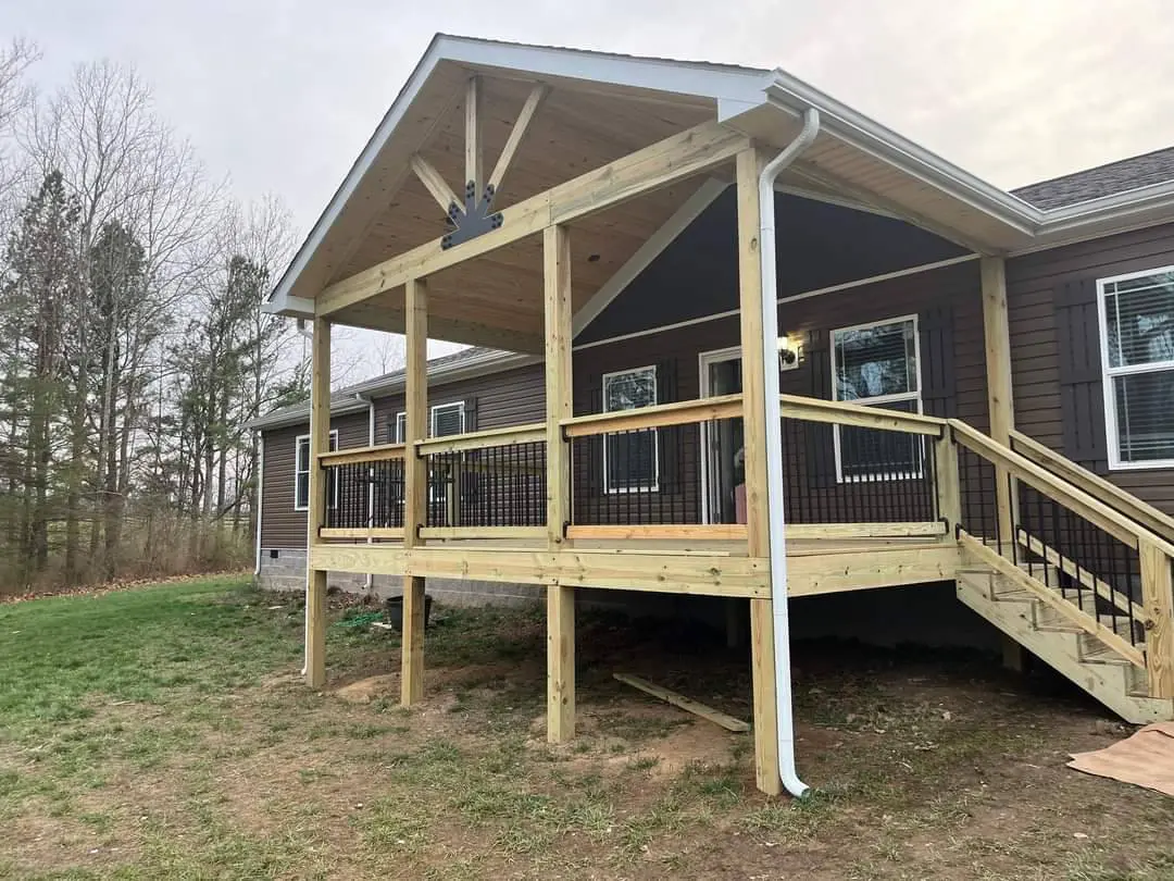 Covered porch with gable roof and deck