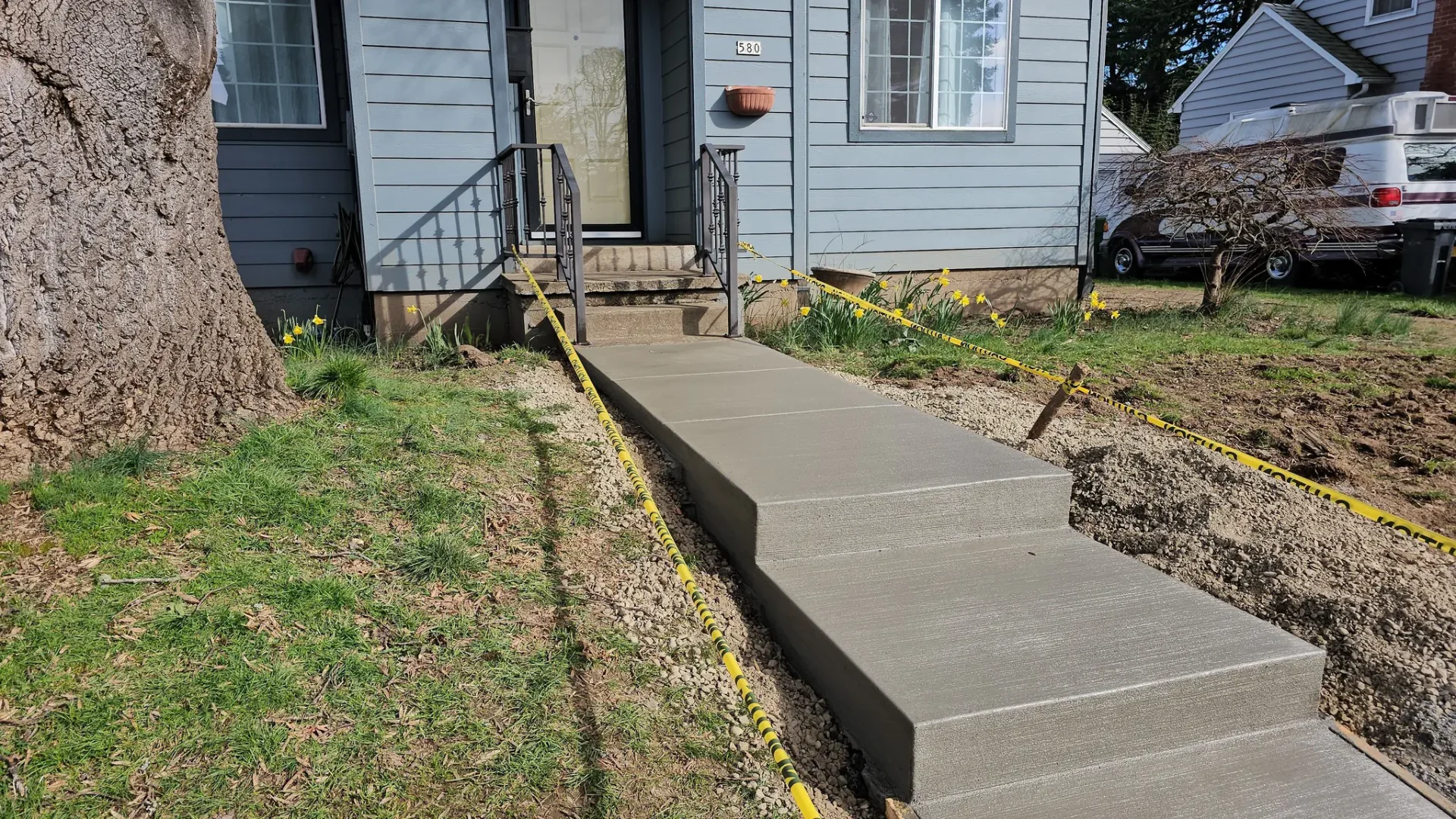 Completed concrete front walkway with steps