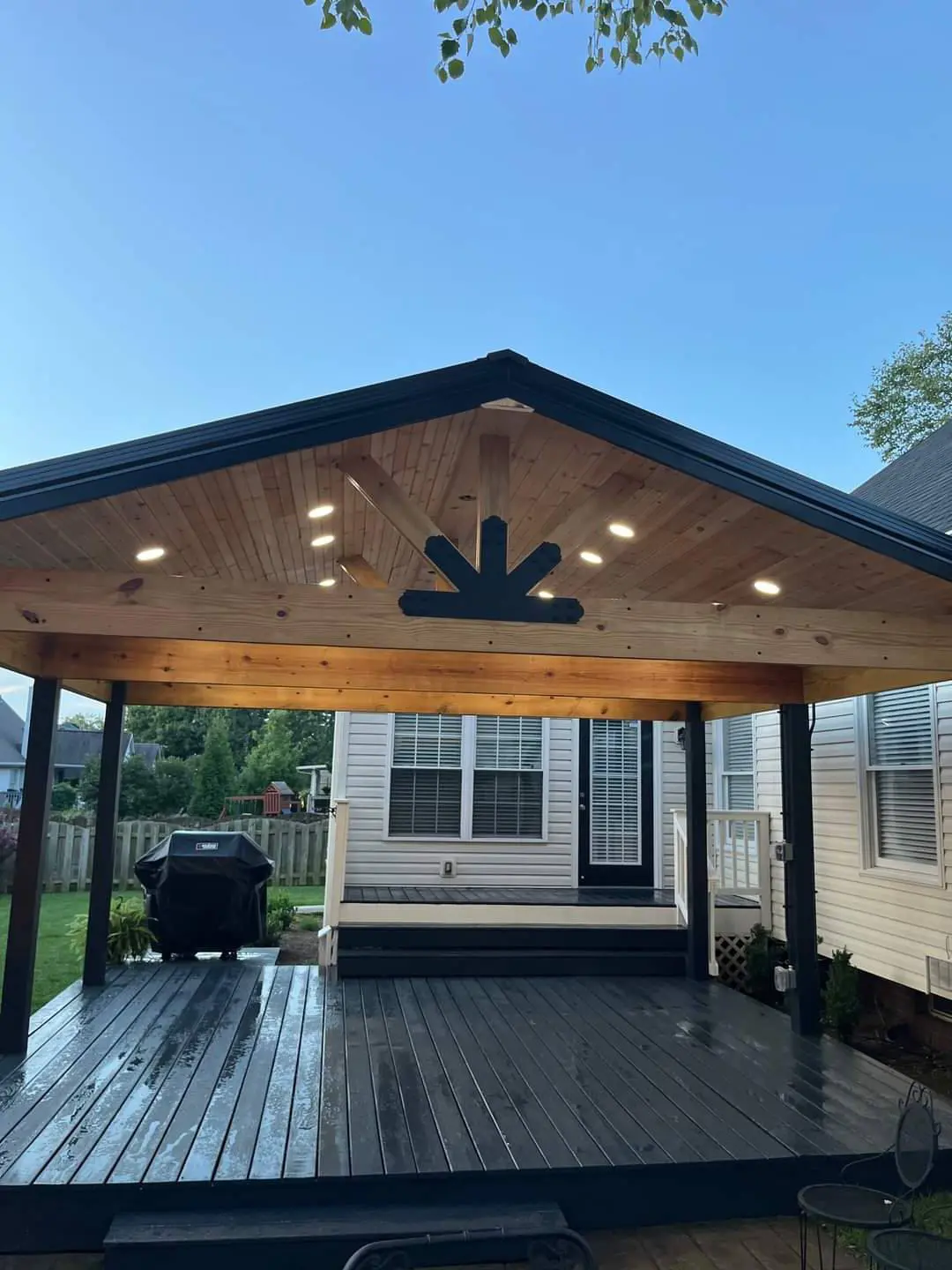 Covered deck with cedar ceiling and recessed lighting