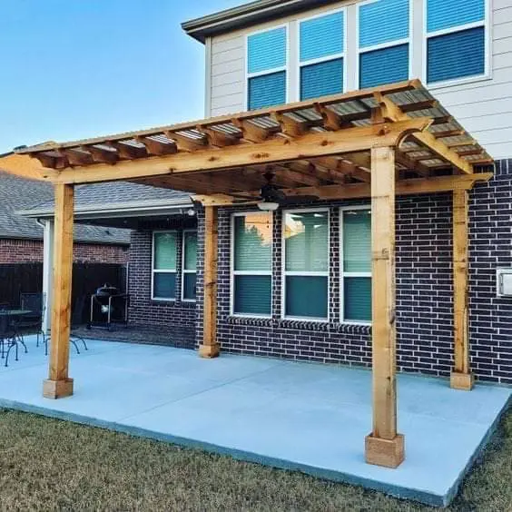 Freestanding cedar pergola on concrete patio