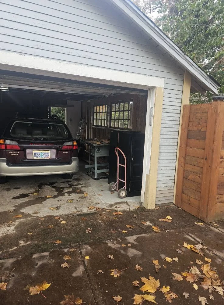 Garage exterior after structural repair and reframing